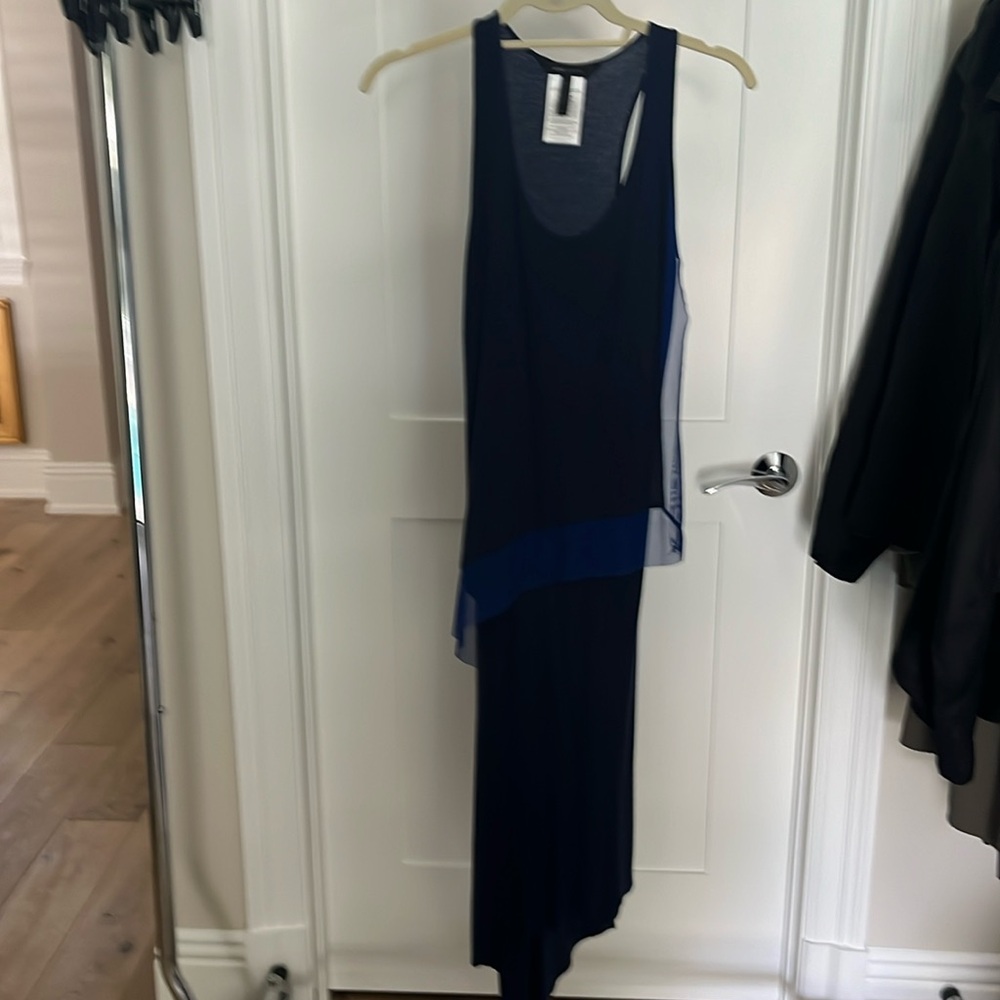 Cute little asymmetrical BCBG dress. MIDI length.